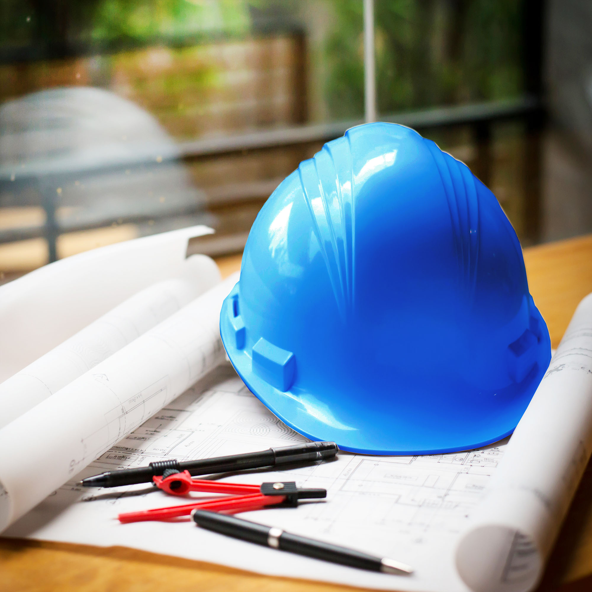 construction concept image helmet rolled blueprints on wooden boards in retro style.